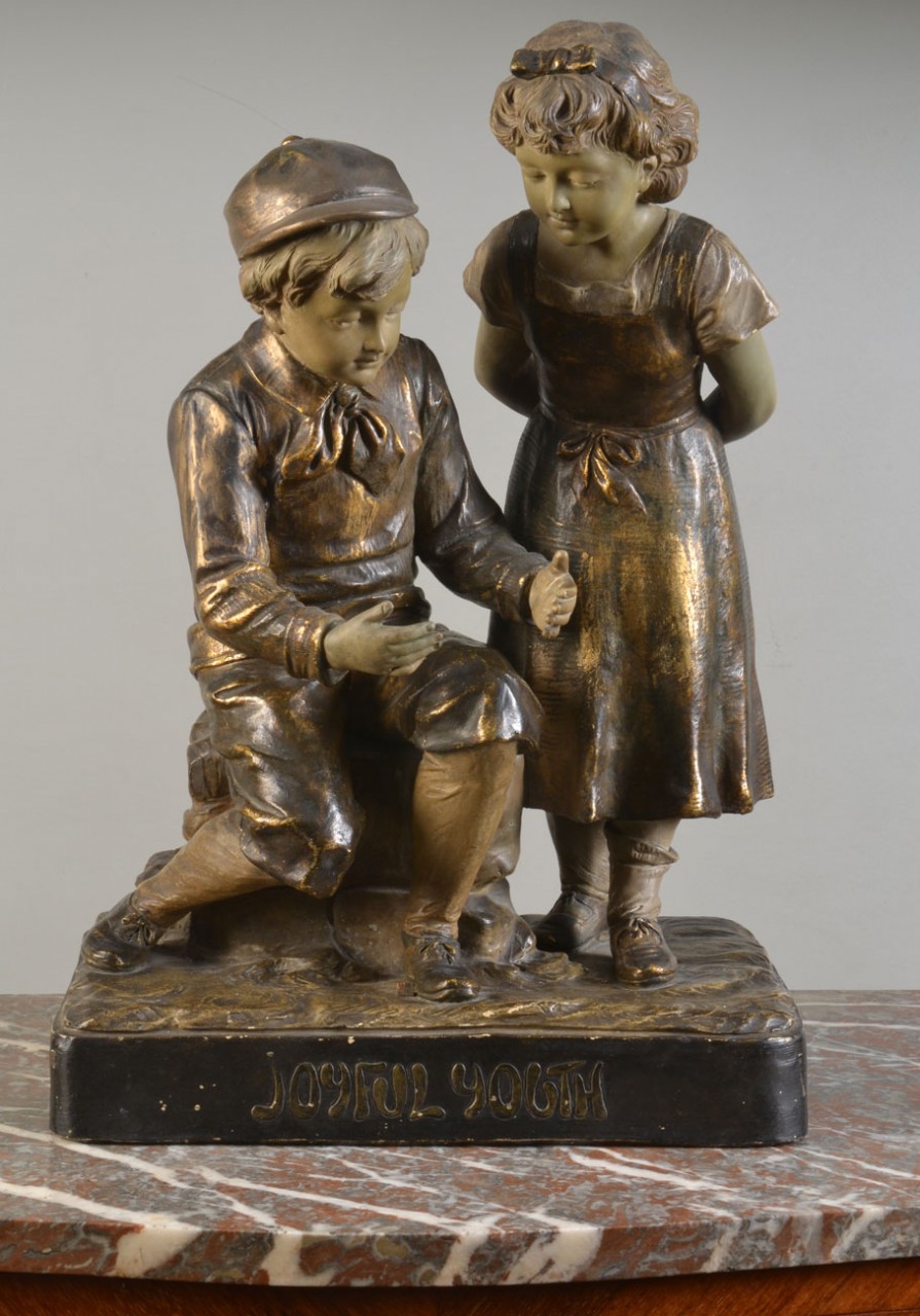 Terracotta figure of two children circa 1910
