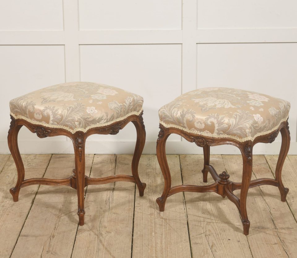 Pair of French Louis XV–Style Carved Walnut Stools