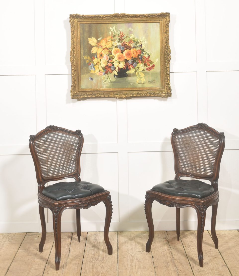 Pair of Louis XV Style Carved Walnut and Caned Side Chairs
