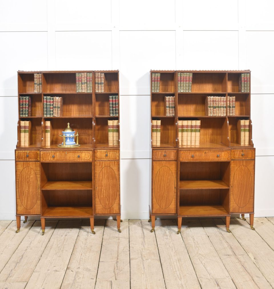 Pair of satinwood crossbanded open breakfront waterfall bookcases