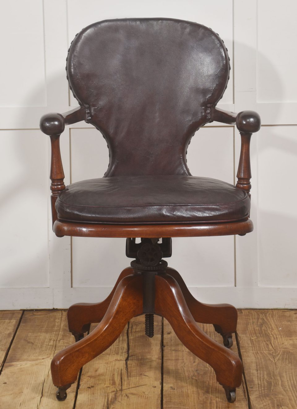 Late Victorian mahogany and leather revolving desk chair